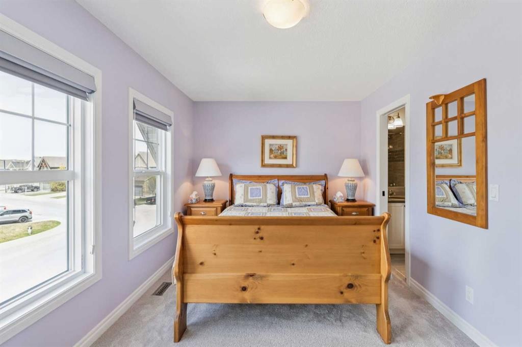 14 Riviera View, Cochrane, AB - Indoor Photo Showing Bedroom