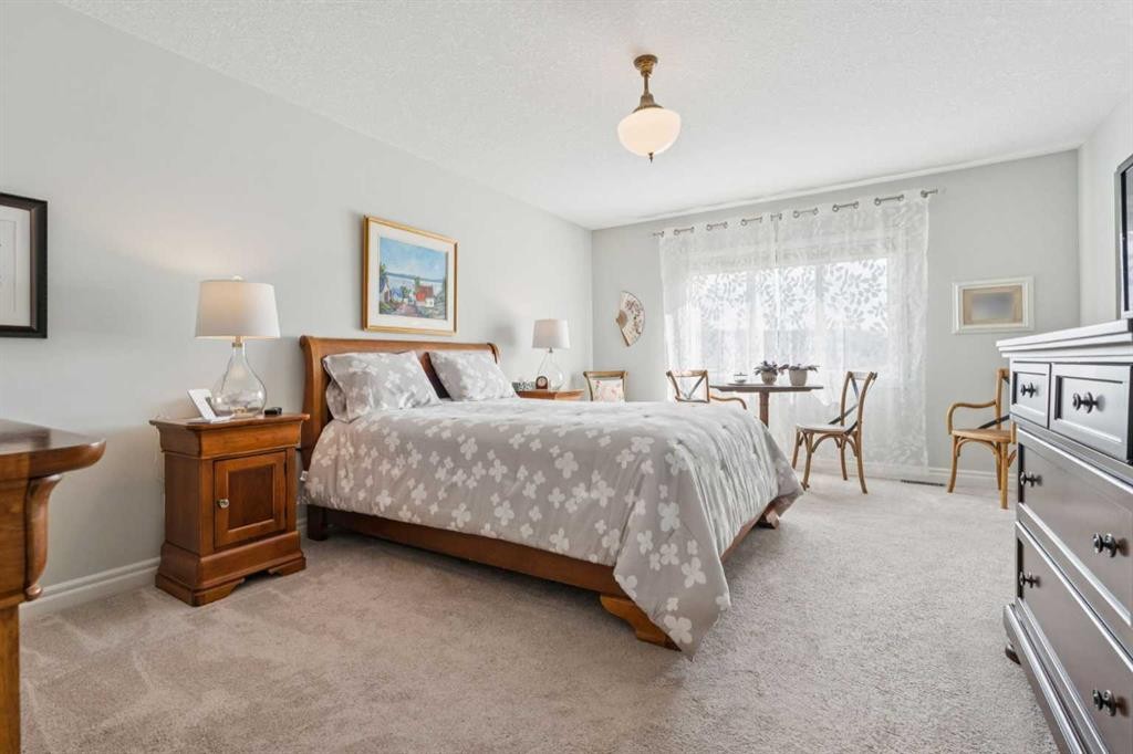 14 Riviera View, Cochrane, AB - Indoor Photo Showing Bedroom