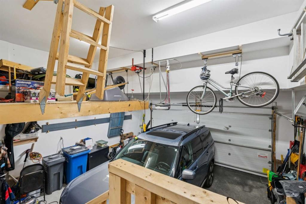 14 Riviera View, Cochrane, AB - Indoor Photo Showing Garage