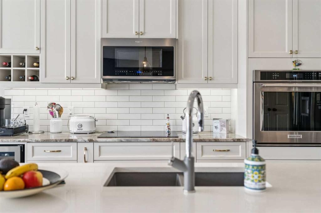 14 Riviera View, Cochrane, AB - Indoor Photo Showing Kitchen With Upgraded Kitchen