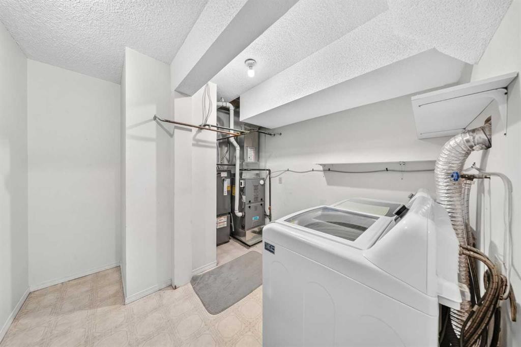 711-200 Brookpark Drive Sw, Calgary, AB - Indoor Photo Showing Laundry Room