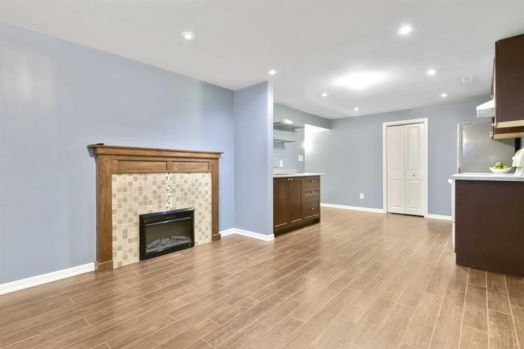 135 Manora Hill Ne, Calgary, AB - Indoor Photo Showing Living Room With Fireplace