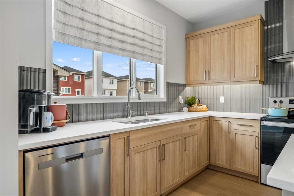 545 Bridgeport Street, Chestermere, AB - Indoor Photo Showing Kitchen With Double Sink