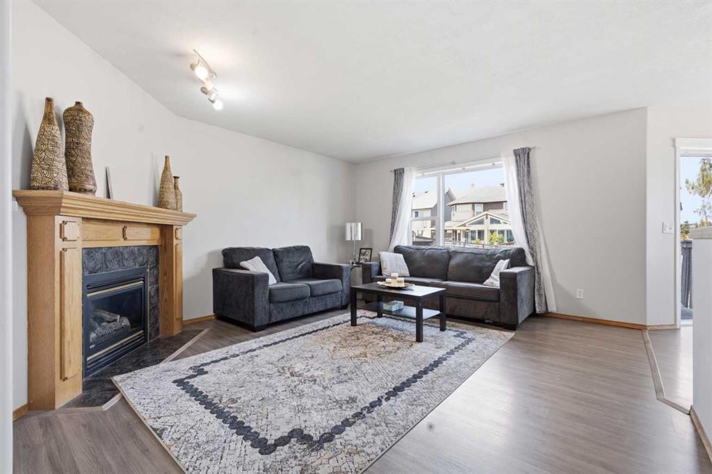 161 Saddlemead Road Ne, Calgary, AB - Indoor Photo Showing Living Room With Fireplace