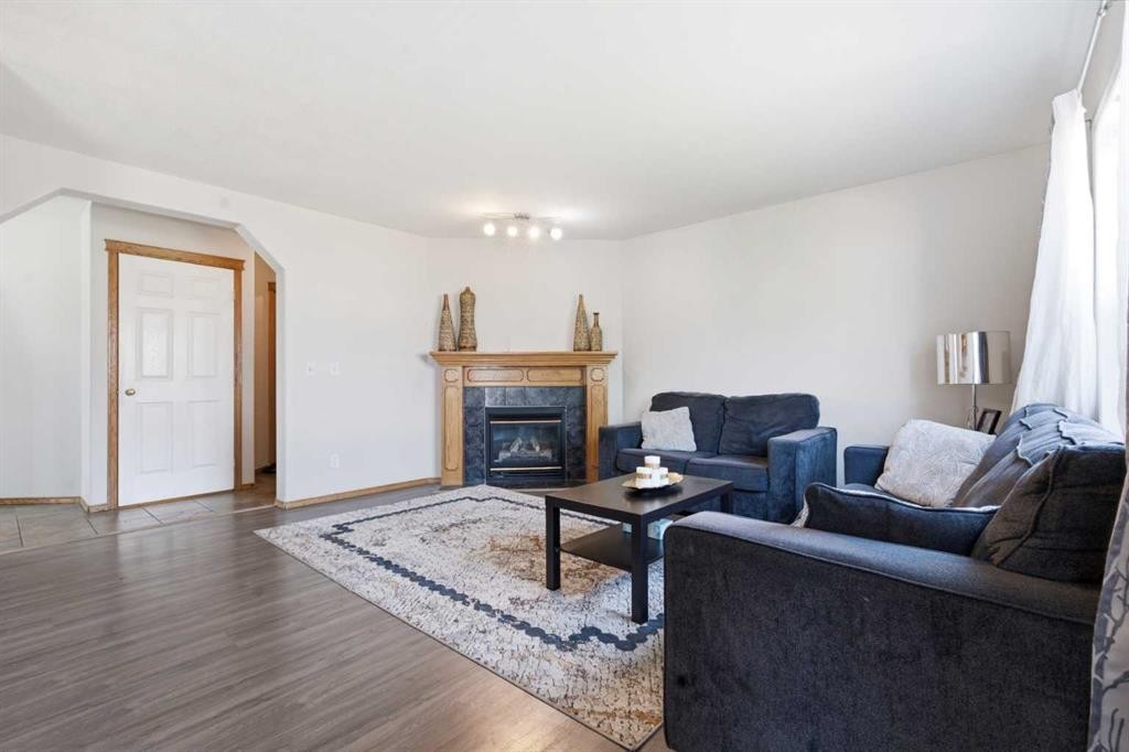 161 Saddlemead Road Ne, Calgary, AB - Indoor Photo Showing Living Room With Fireplace