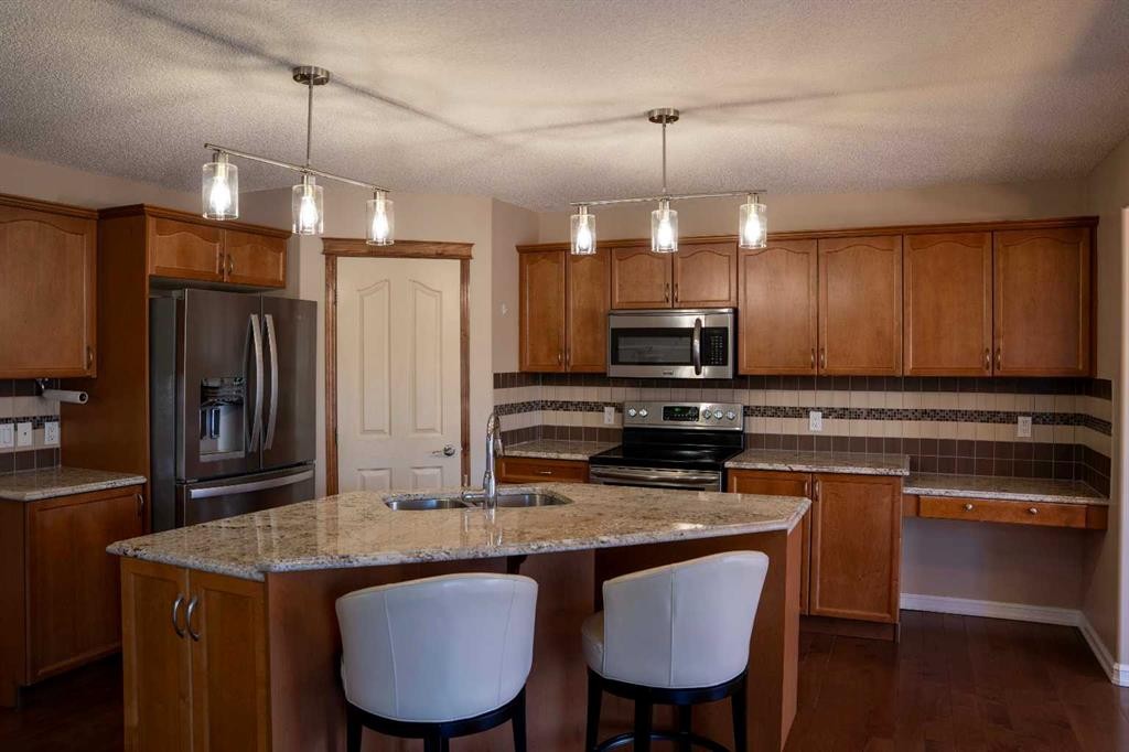 329 Springmere Way, Chestermere, AB - Indoor Photo Showing Kitchen With Stainless Steel Kitchen With Double Sink