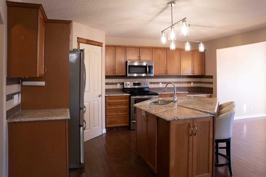 329 Springmere Way, Chestermere, AB - Indoor Photo Showing Kitchen With Double Sink
