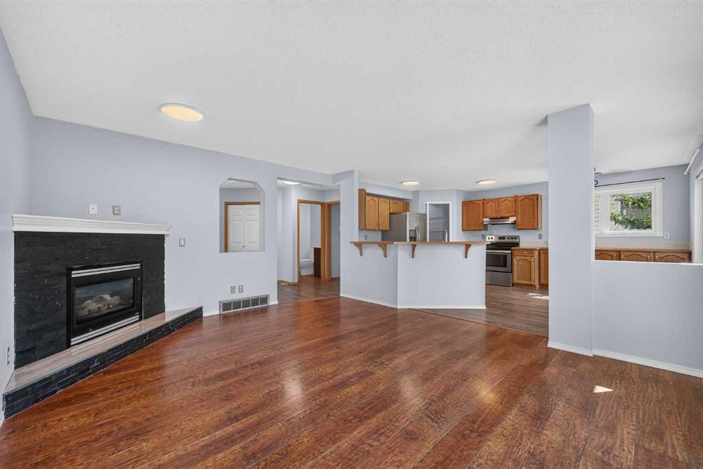 446 Harvest Hills Drive Ne, Calgary, AB - Indoor Photo Showing Living Room With Fireplace
