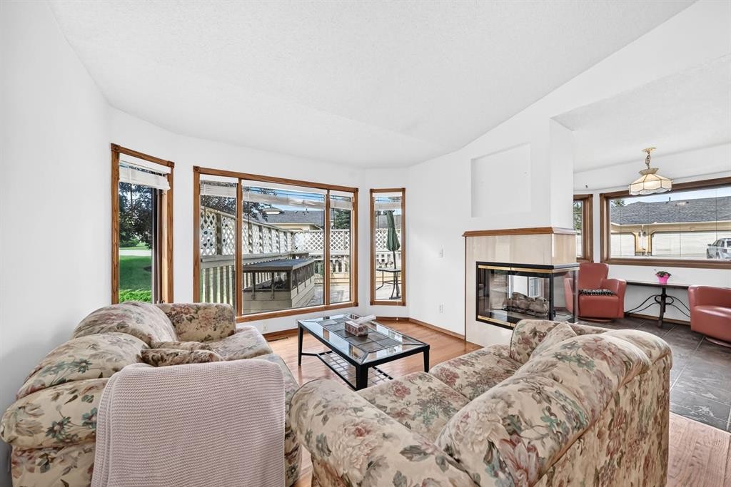 8 Sunlake Close Se, Calgary, AB - Indoor Photo Showing Living Room With Fireplace