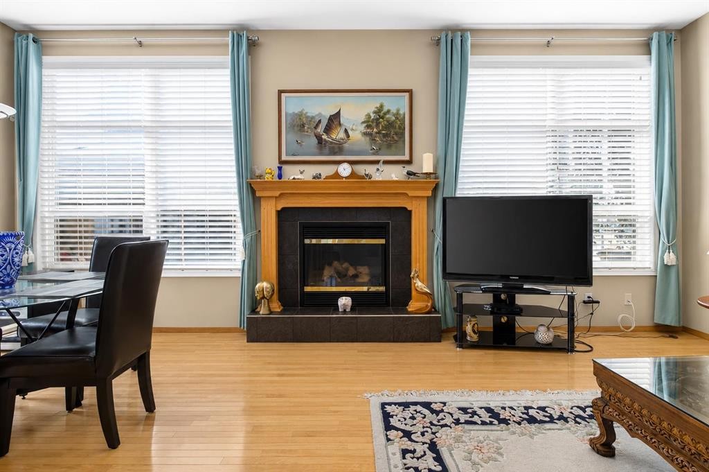 44 Strathlea Close Sw, Calgary, AB - Indoor Photo Showing Living Room With Fireplace