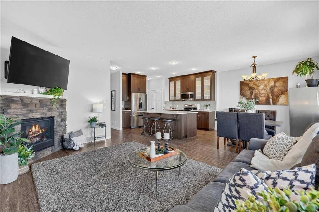 61 Hanson Lane Ne, Langdon, AB - Indoor Photo Showing Living Room With Fireplace