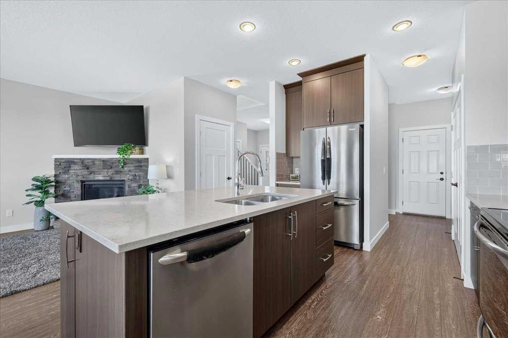 61 Hanson Lane Ne, Langdon, AB - Indoor Photo Showing Kitchen With Stainless Steel Kitchen With Double Sink With Upgraded Kitchen