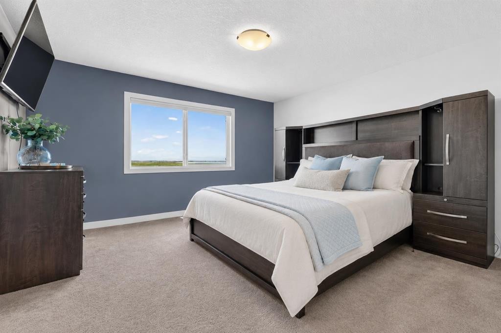 61 Hanson Lane Ne, Langdon, AB - Indoor Photo Showing Bedroom