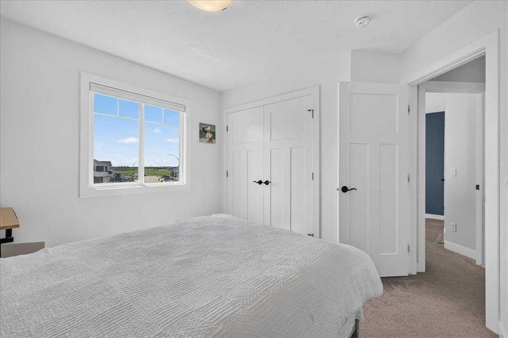 61 Hanson Lane Ne, Langdon, AB - Indoor Photo Showing Bedroom
