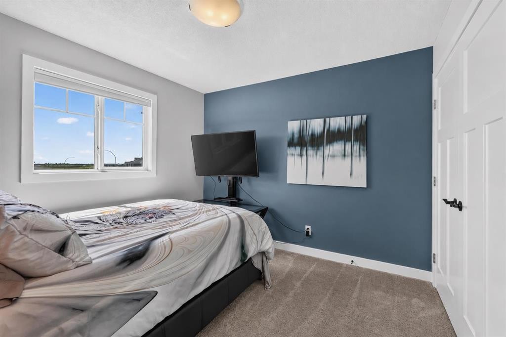 61 Hanson Lane Ne, Langdon, AB - Indoor Photo Showing Bedroom