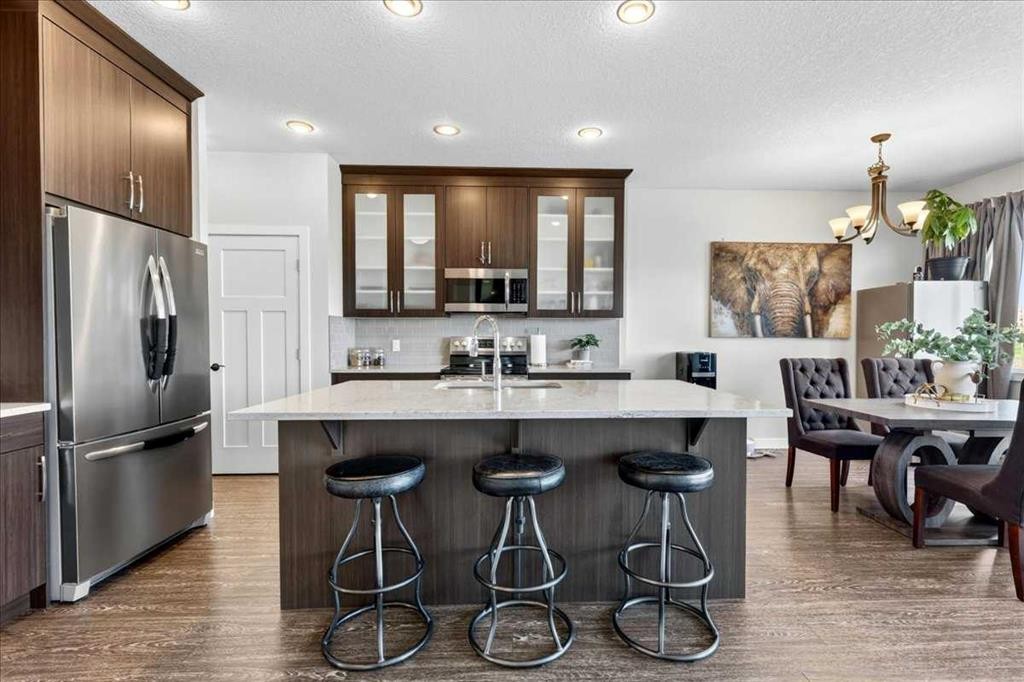 61 Hanson Lane Ne, Langdon, AB - Indoor Photo Showing Kitchen With Stainless Steel Kitchen With Upgraded Kitchen