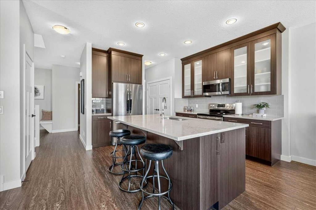 61 Hanson Lane Ne, Langdon, AB - Indoor Photo Showing Kitchen With Stainless Steel Kitchen With Upgraded Kitchen