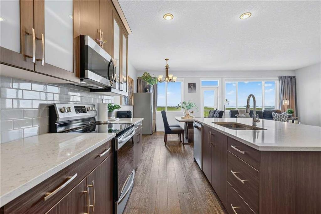 61 Hanson Lane Ne, Langdon, AB - Indoor Photo Showing Kitchen With Double Sink With Upgraded Kitchen