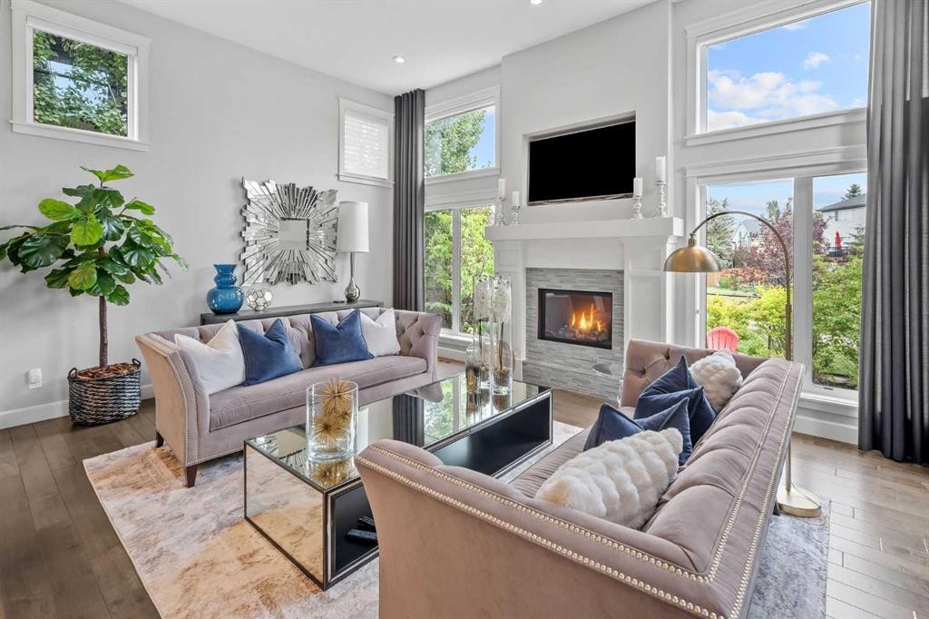 656 Quarry Way Se, Calgary, AB - Indoor Photo Showing Living Room With Fireplace