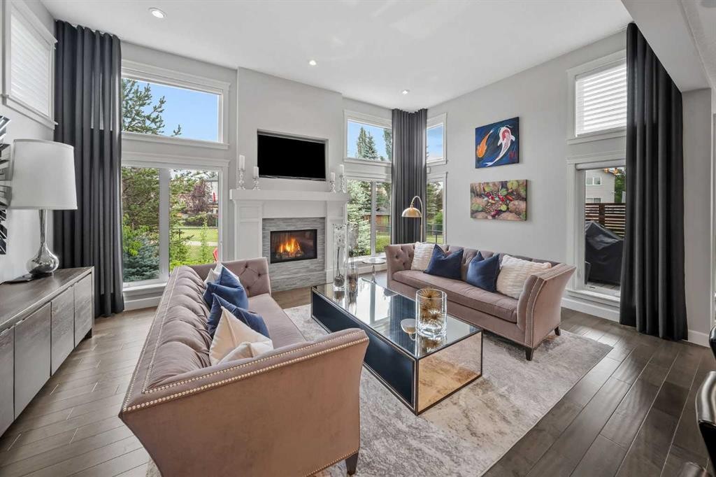 656 Quarry Way Se, Calgary, AB - Indoor Photo Showing Living Room With Fireplace