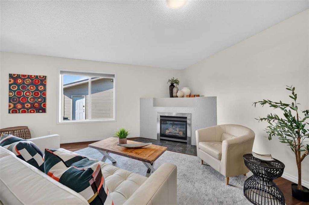 307 Covehaven View Ne, Calgary, AB - Indoor Photo Showing Living Room With Fireplace