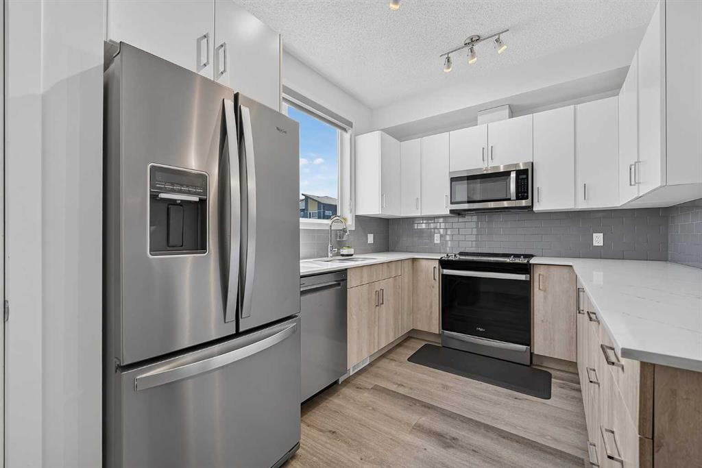 433-301 Redstone Boulevard Ne, Calgary, AB - Indoor Photo Showing Kitchen With Stainless Steel Kitchen With Upgraded Kitchen