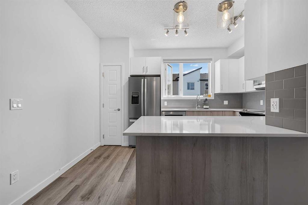 433-301 Redstone Boulevard Ne, Calgary, AB - Indoor Photo Showing Kitchen With Stainless Steel Kitchen With Upgraded Kitchen