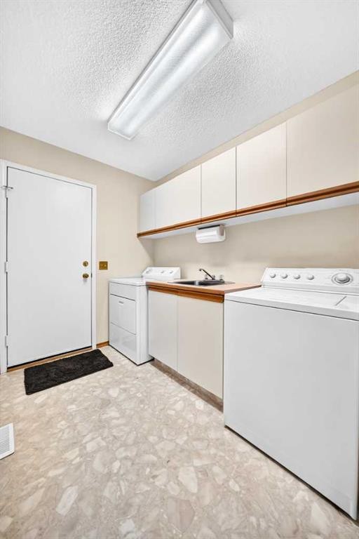 36 Sunset Way, Priddis Greens, AB - Indoor Photo Showing Laundry Room
