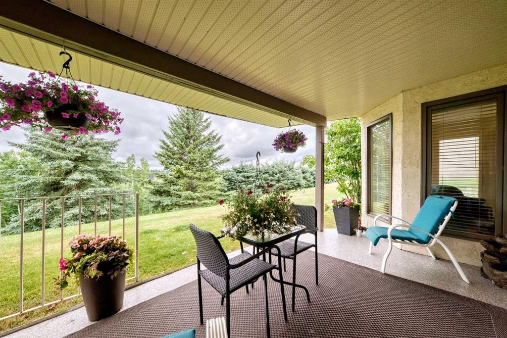36 Sunset Way, Priddis Greens, AB - Outdoor With Deck Patio Veranda With Exterior