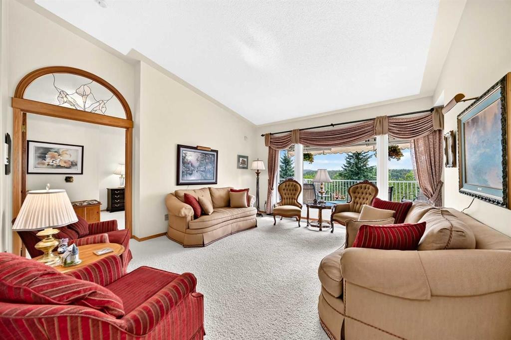 36 Sunset Way, Priddis Greens, AB - Indoor Photo Showing Living Room