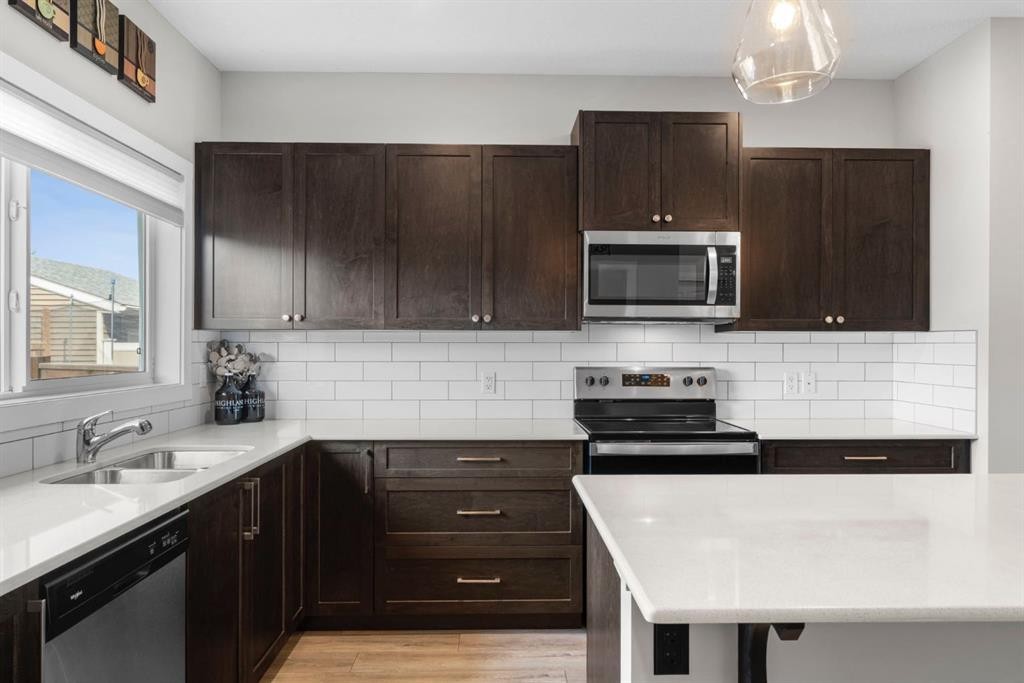 115 Wolf Willow Boulevard Se, Calgary, AB - Indoor Photo Showing Kitchen With Stainless Steel Kitchen With Double Sink With Upgraded Kitchen