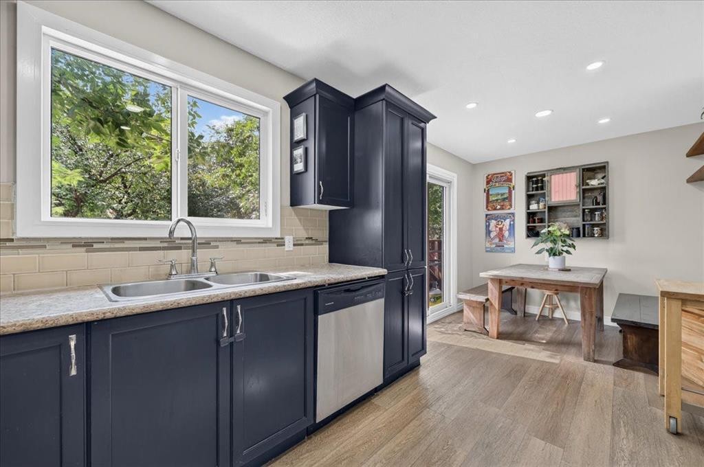 57 Beacham Way Nw, Calgary, AB - Indoor Photo Showing Kitchen With Double Sink