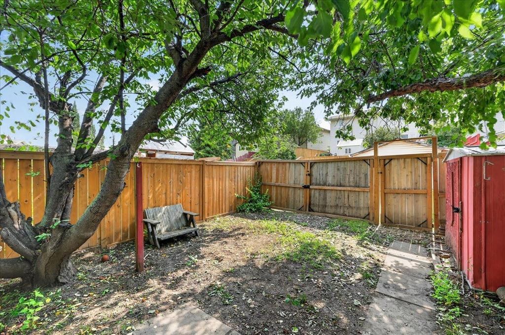 57 Beacham Way Nw, Calgary, AB - Outdoor With Backyard