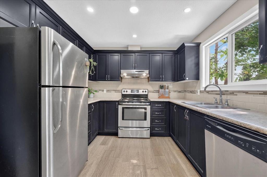 57 Beacham Way Nw, Calgary, AB - Indoor Photo Showing Kitchen With Stainless Steel Kitchen