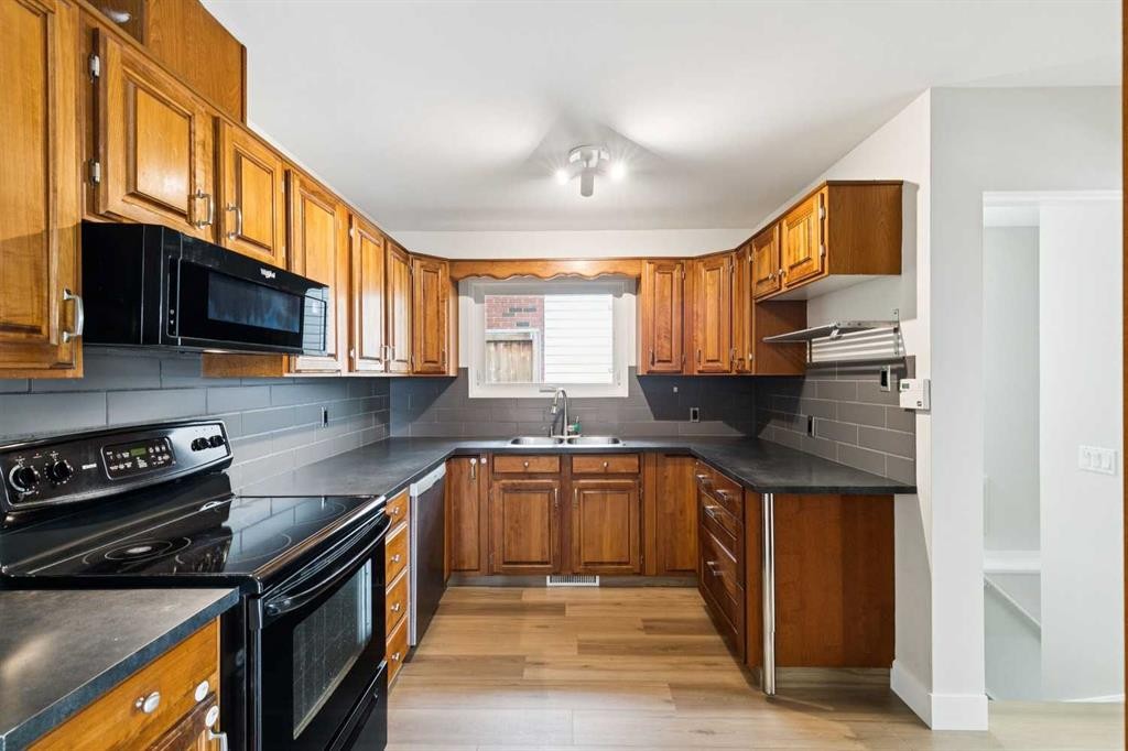 10415 8 Street Sw, Calgary, AB - Indoor Photo Showing Kitchen With Double Sink