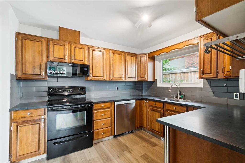 10415 8 Street Sw, Calgary, AB - Indoor Photo Showing Kitchen With Double Sink