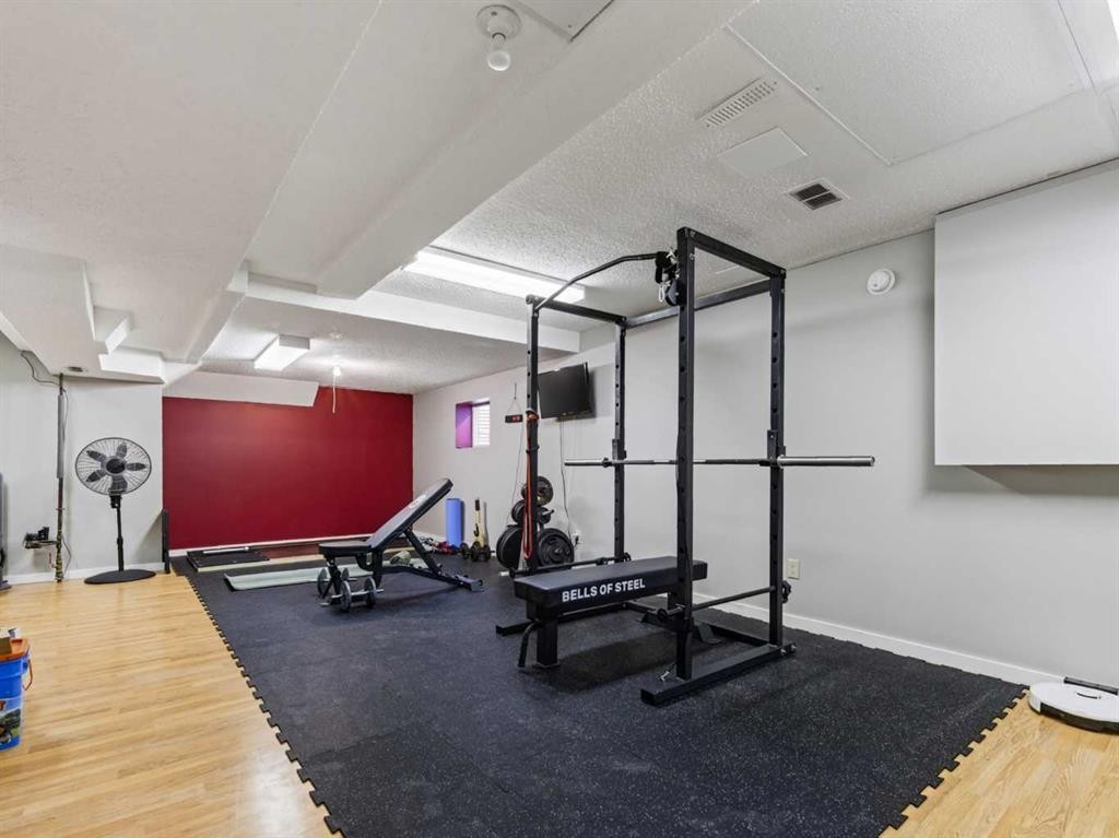115 Wood Valley Court Sw, Calgary, AB - Indoor Photo Showing Gym Room