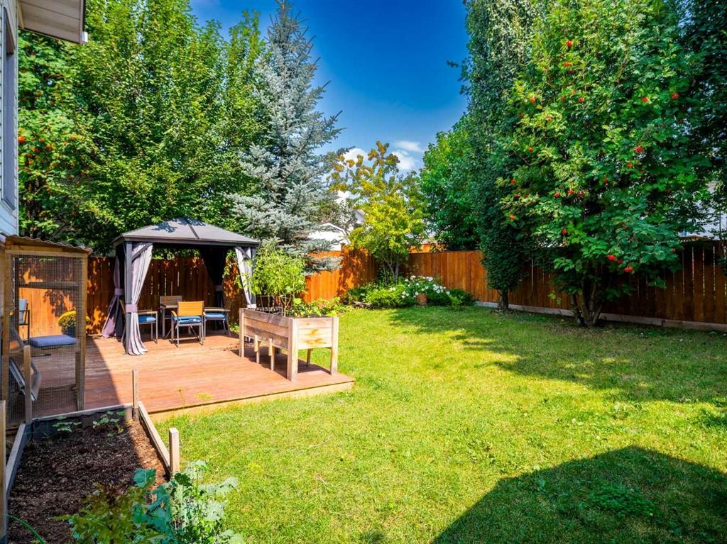 115 Wood Valley Court Sw, Calgary, AB - Outdoor With Deck Patio Veranda With Backyard