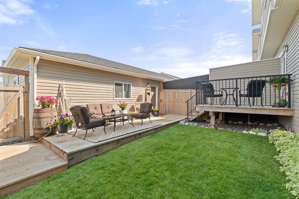 45 Willow Green Way, Cochrane, AB - Outdoor With Deck Patio Veranda With Exterior