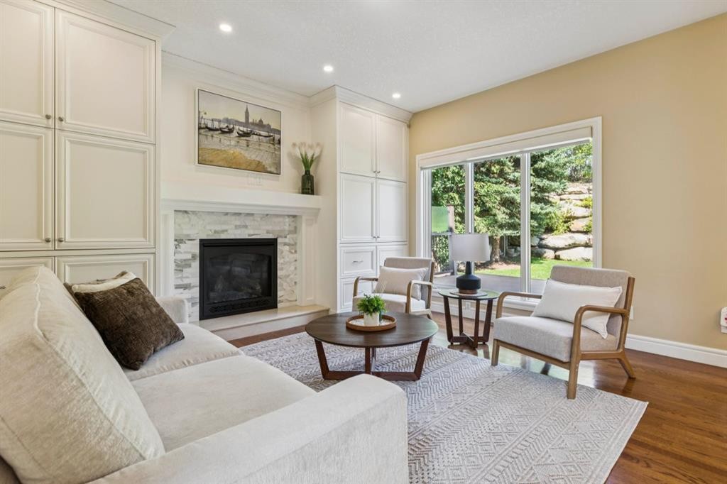 174 Sienna Hills Drive Sw, Calgary, AB - Indoor Photo Showing Living Room With Fireplace