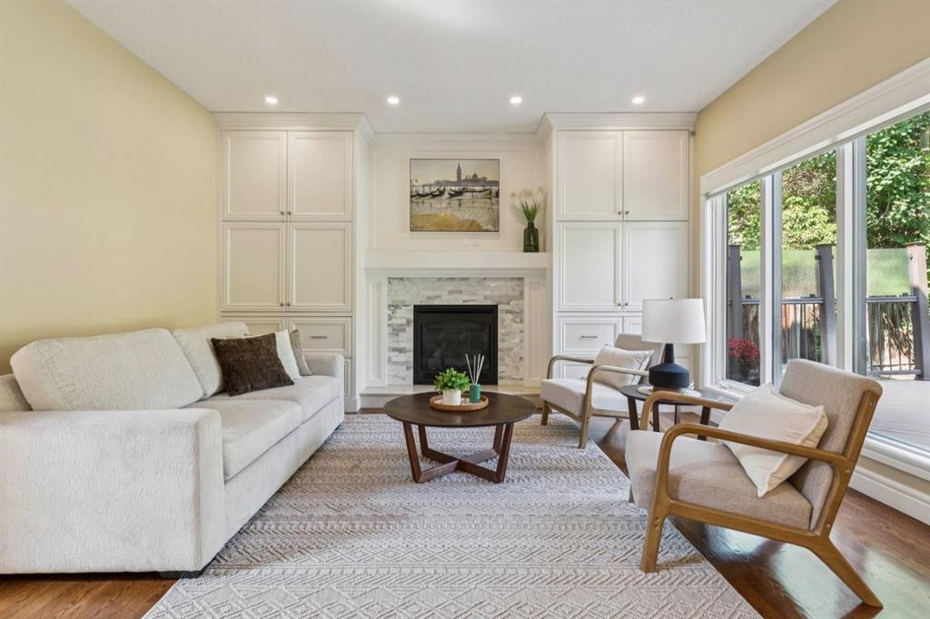 174 Sienna Hills Drive Sw, Calgary, AB - Indoor Photo Showing Living Room With Fireplace