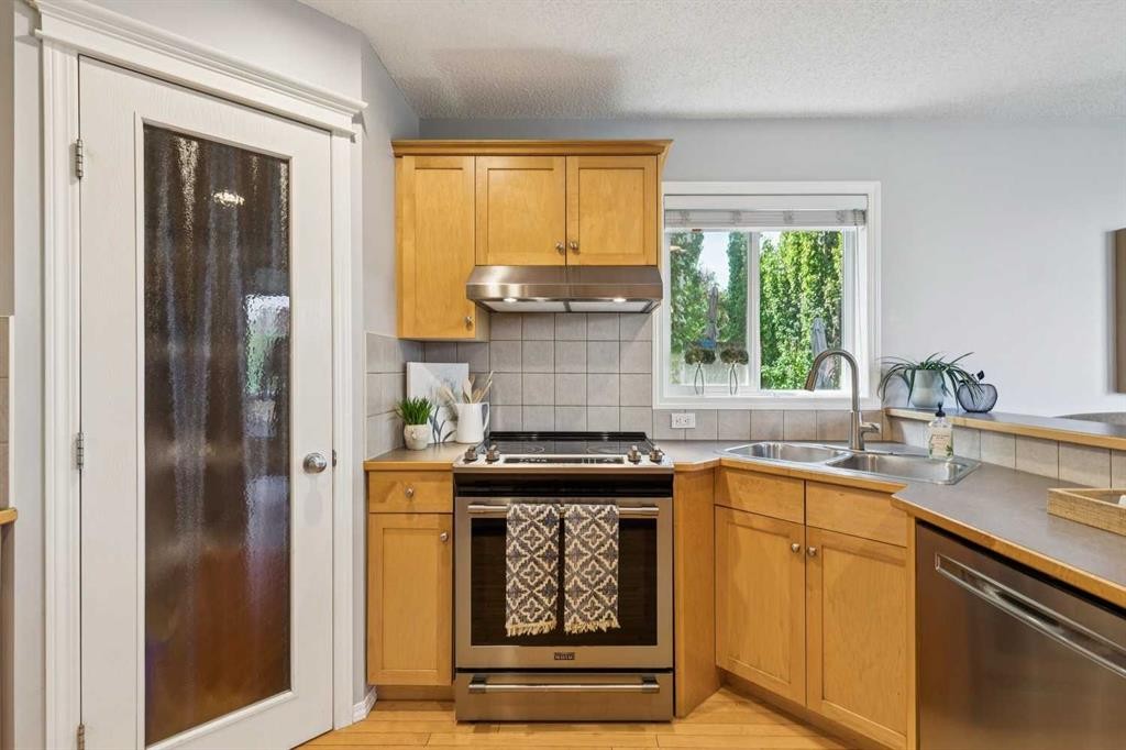 258 West Ranch Place Sw, Calgary, AB - Indoor Photo Showing Kitchen With Double Sink