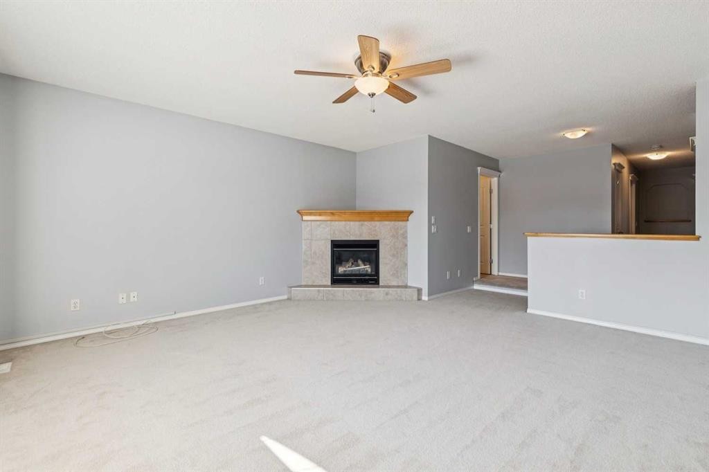 258 West Ranch Place Sw, Calgary, AB - Indoor Photo Showing Other Room With Fireplace