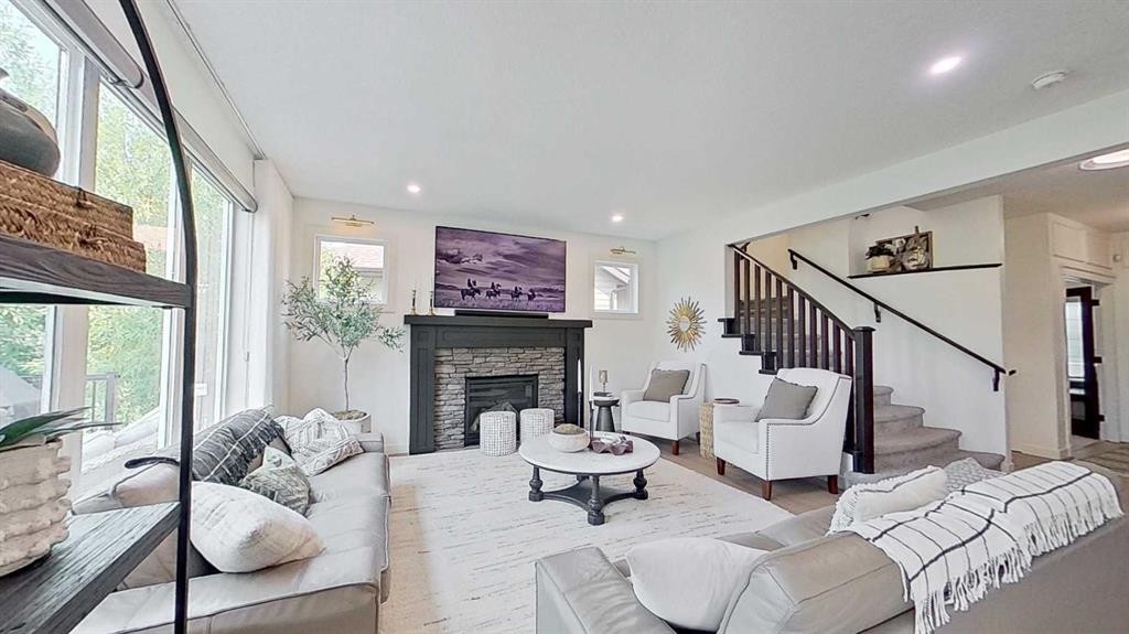 107 Auburn Sound Cove Se, Calgary, AB - Indoor Photo Showing Living Room With Fireplace