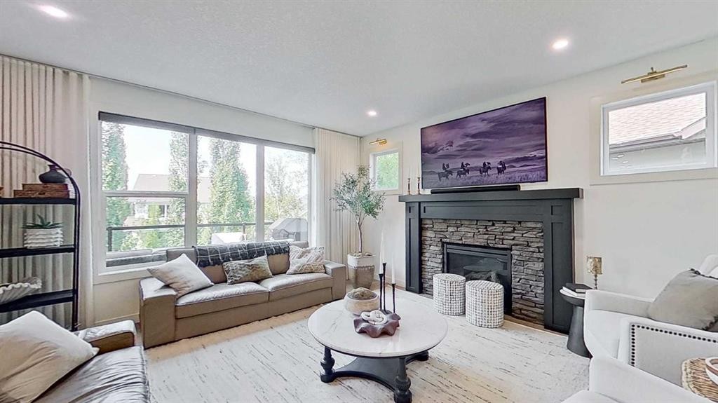 107 Auburn Sound Cove Se, Calgary, AB - Indoor Photo Showing Living Room With Fireplace
