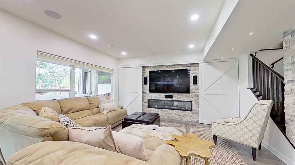 107 Auburn Sound Cove Se, Calgary, AB - Indoor Photo Showing Living Room With Fireplace