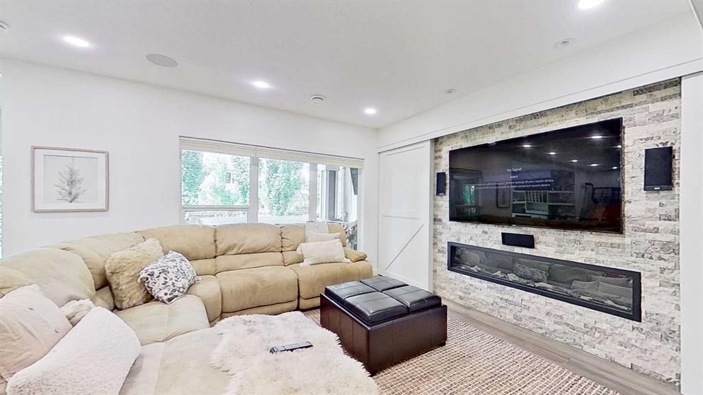 107 Auburn Sound Cove Se, Calgary, AB - Indoor Photo Showing Living Room With Fireplace