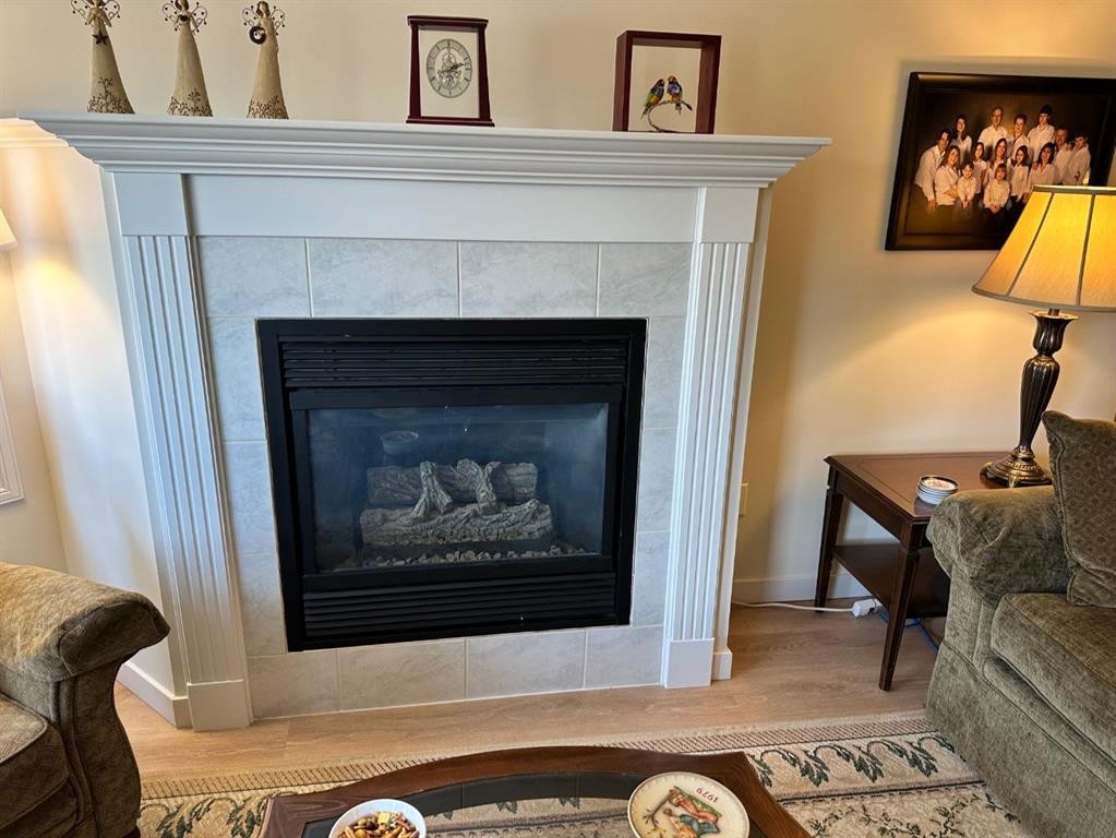 3338-1818 Simcoe Boulevard Sw, Calgary, AB - Indoor Photo Showing Living Room With Fireplace