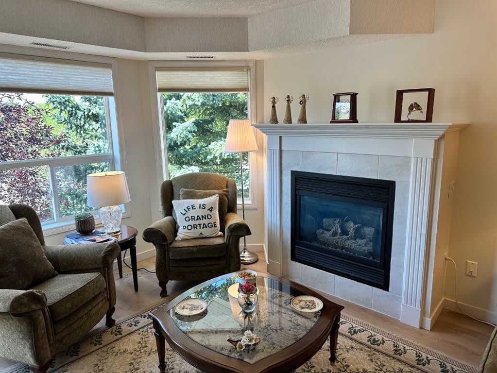 3338-1818 Simcoe Boulevard Sw, Calgary, AB - Indoor Photo Showing Living Room With Fireplace