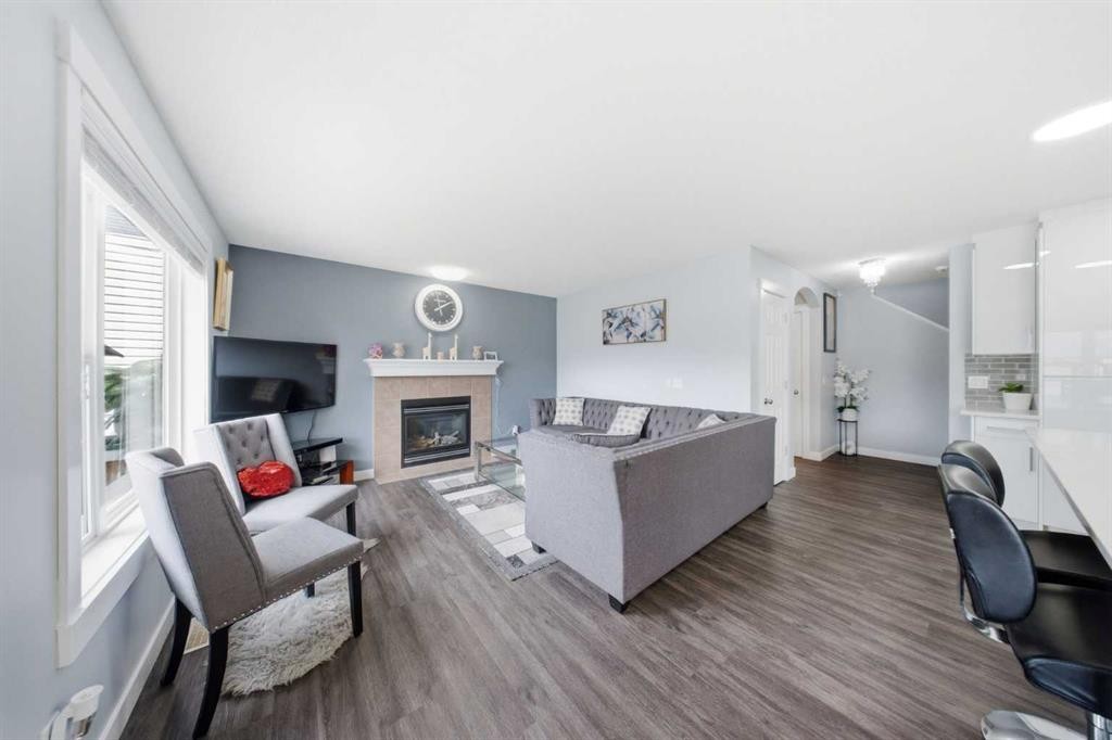 19 Martha'S Meadow Close Ne, Calgary, AB - Indoor Photo Showing Living Room With Fireplace